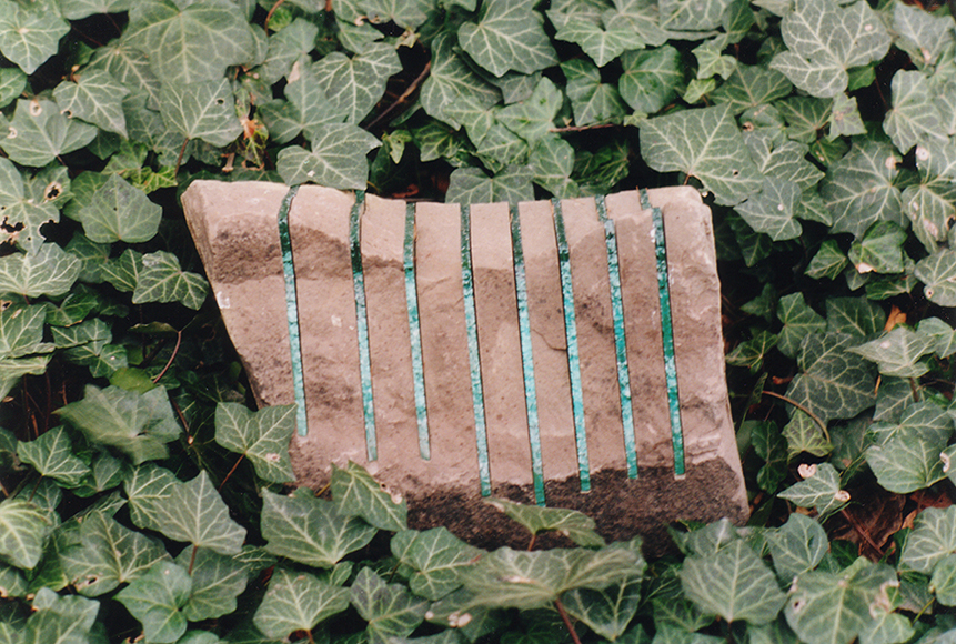Stone with glass incisions